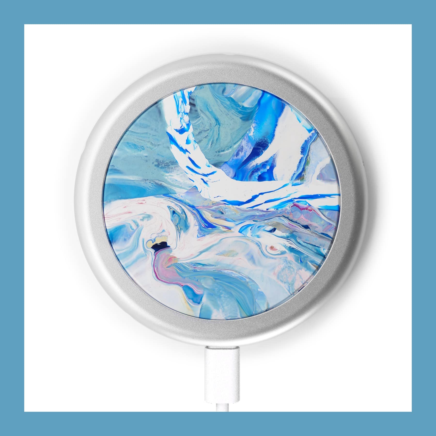gomi wireless charger pad with a blue and white marbled recycled plastic top in an aluminium ring, USB-C cable attached
