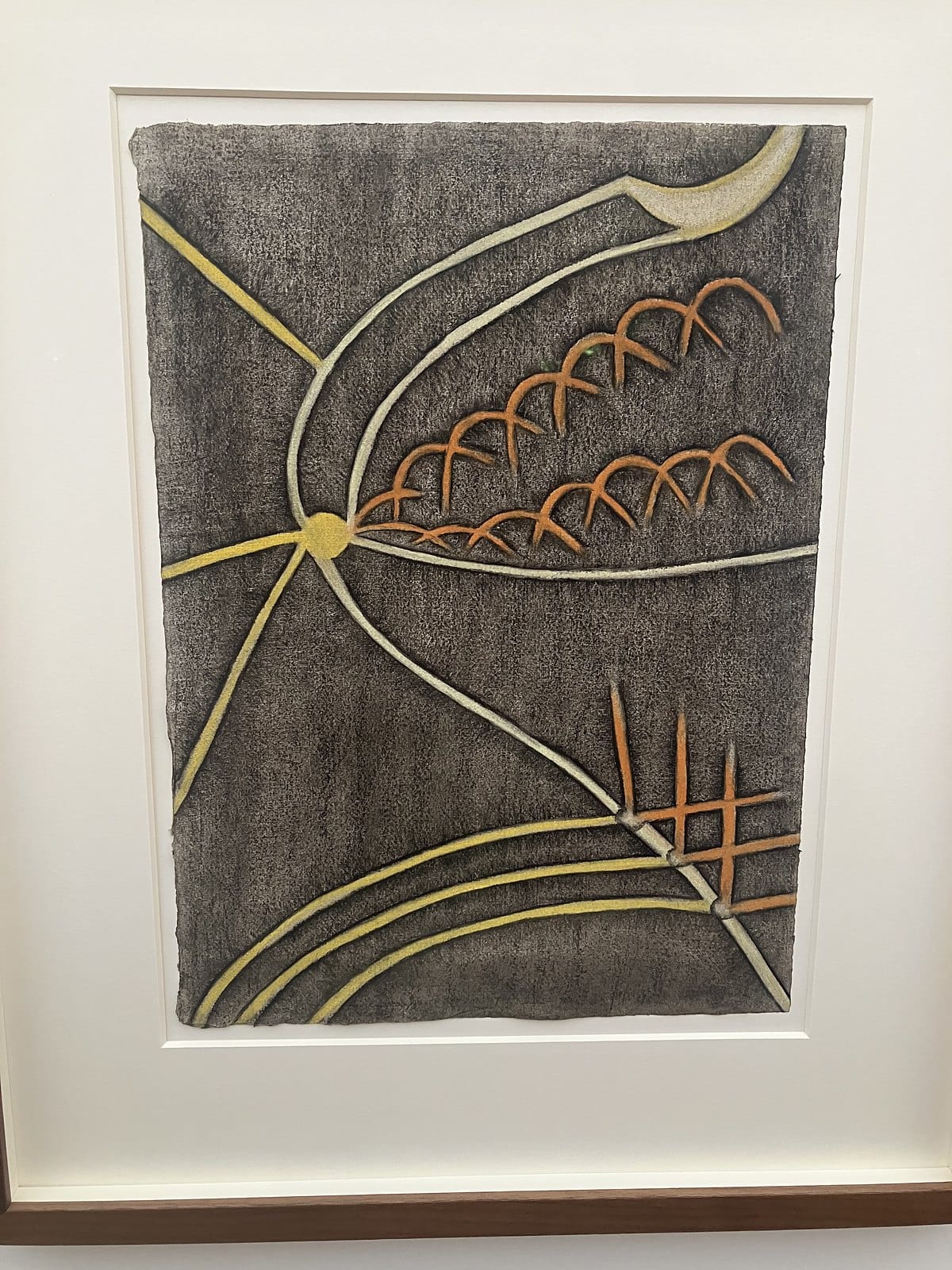 Anna Zemánková pastel of yellow and white curving lines with orange arches on a dark grey ground
