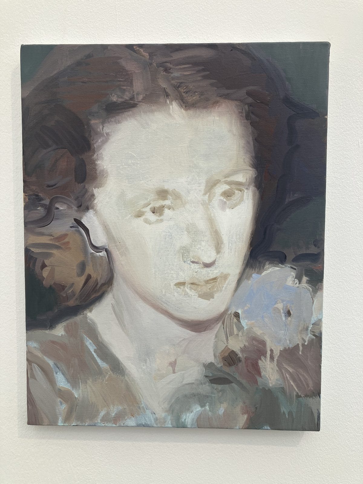 Kaye Donachie portrait of a woman with pale flowers at her shoulder