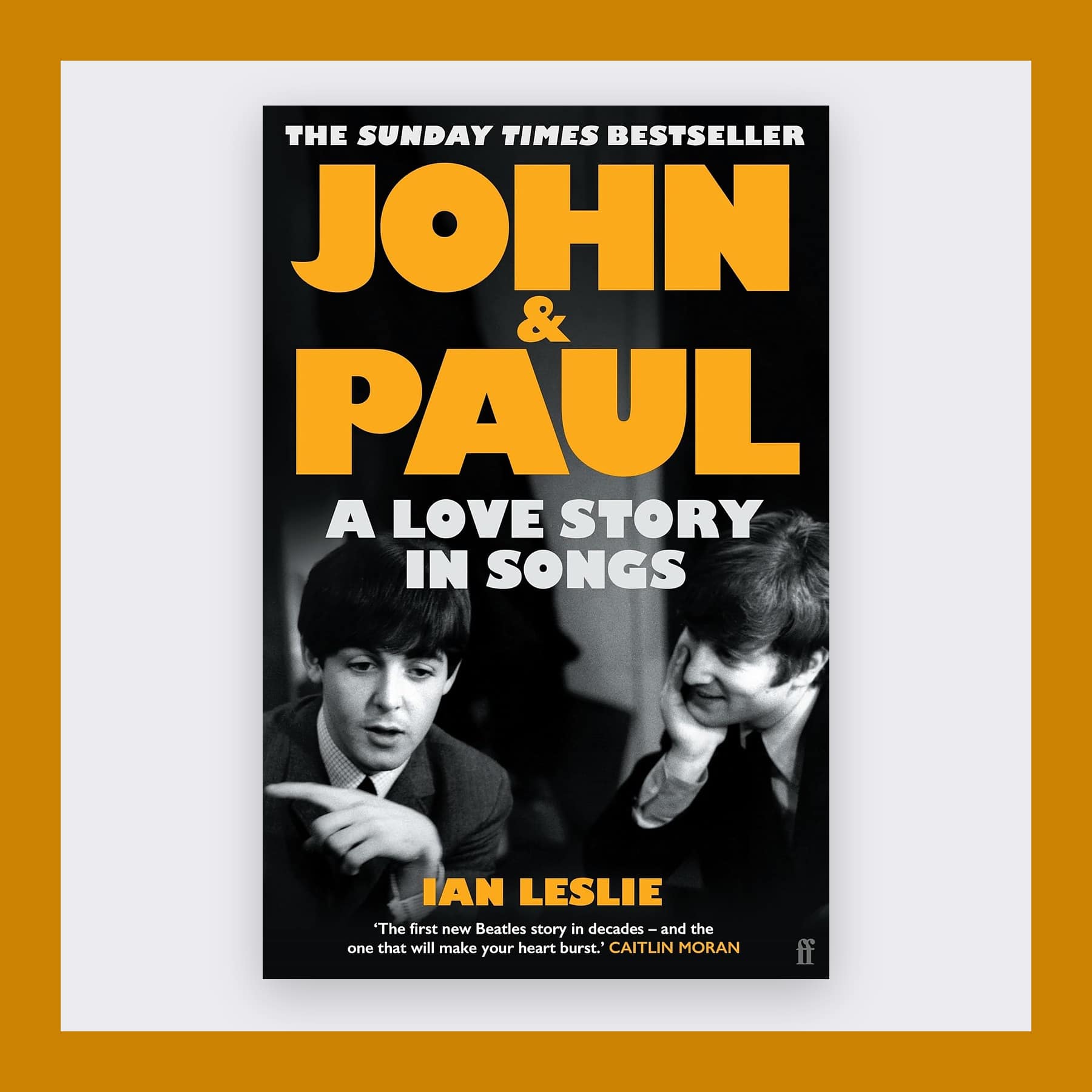 Black cover of John and Paul with yellow lettering and a photo of Lennon and McCartney, in an amber frame