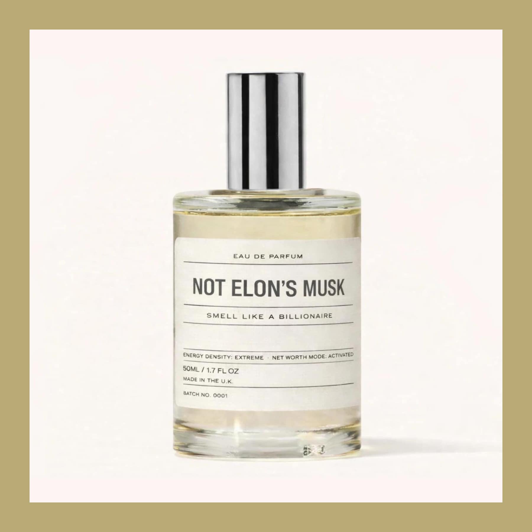 A clear bottle of Not Elon's Musk eau de parfum with a silver cap and a white label reading Smell Like a Billionaire, inside a gold border.