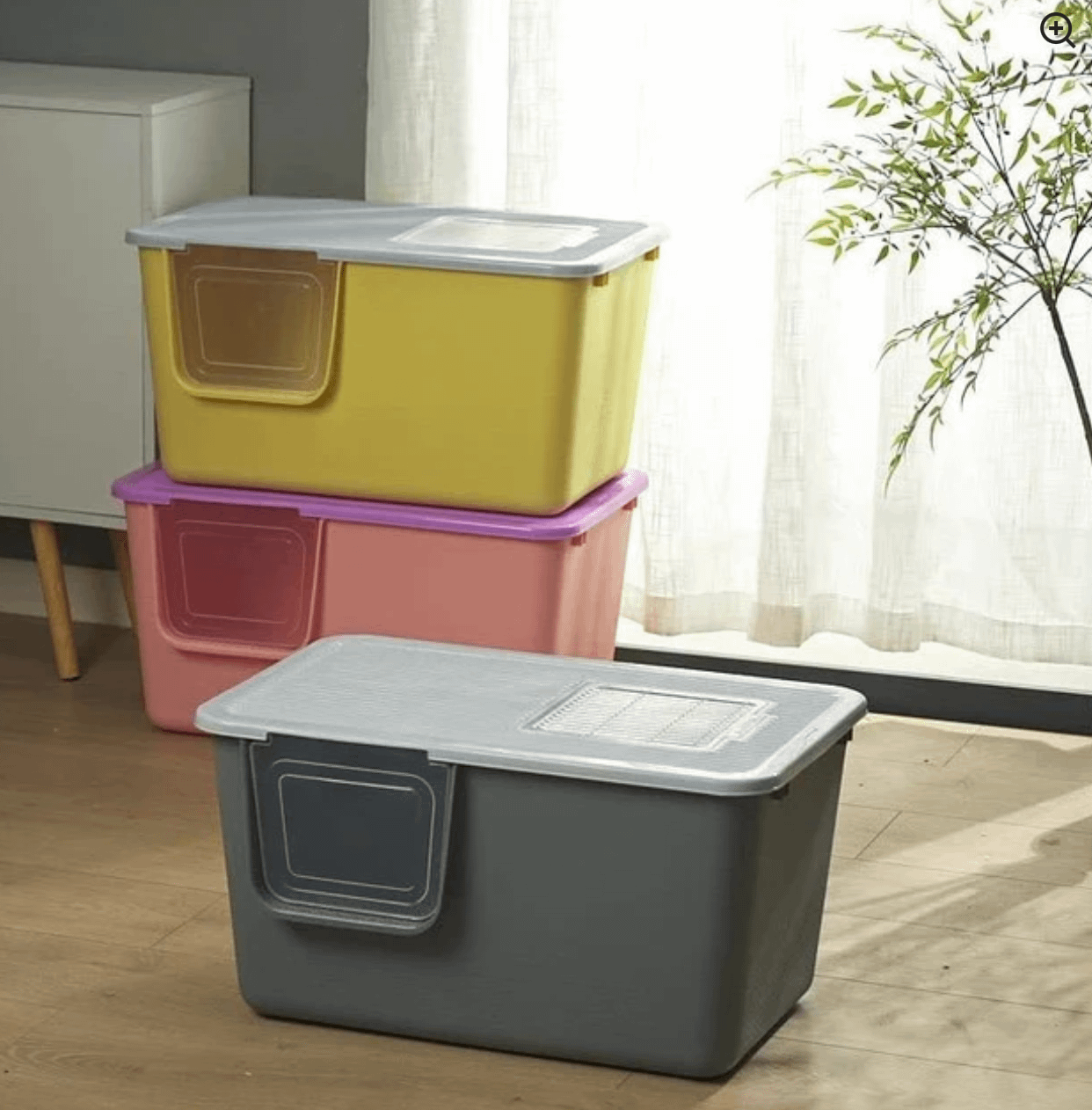 Stack of colourful covered cat litter boxes with top entry and scoop from Pets Villa
