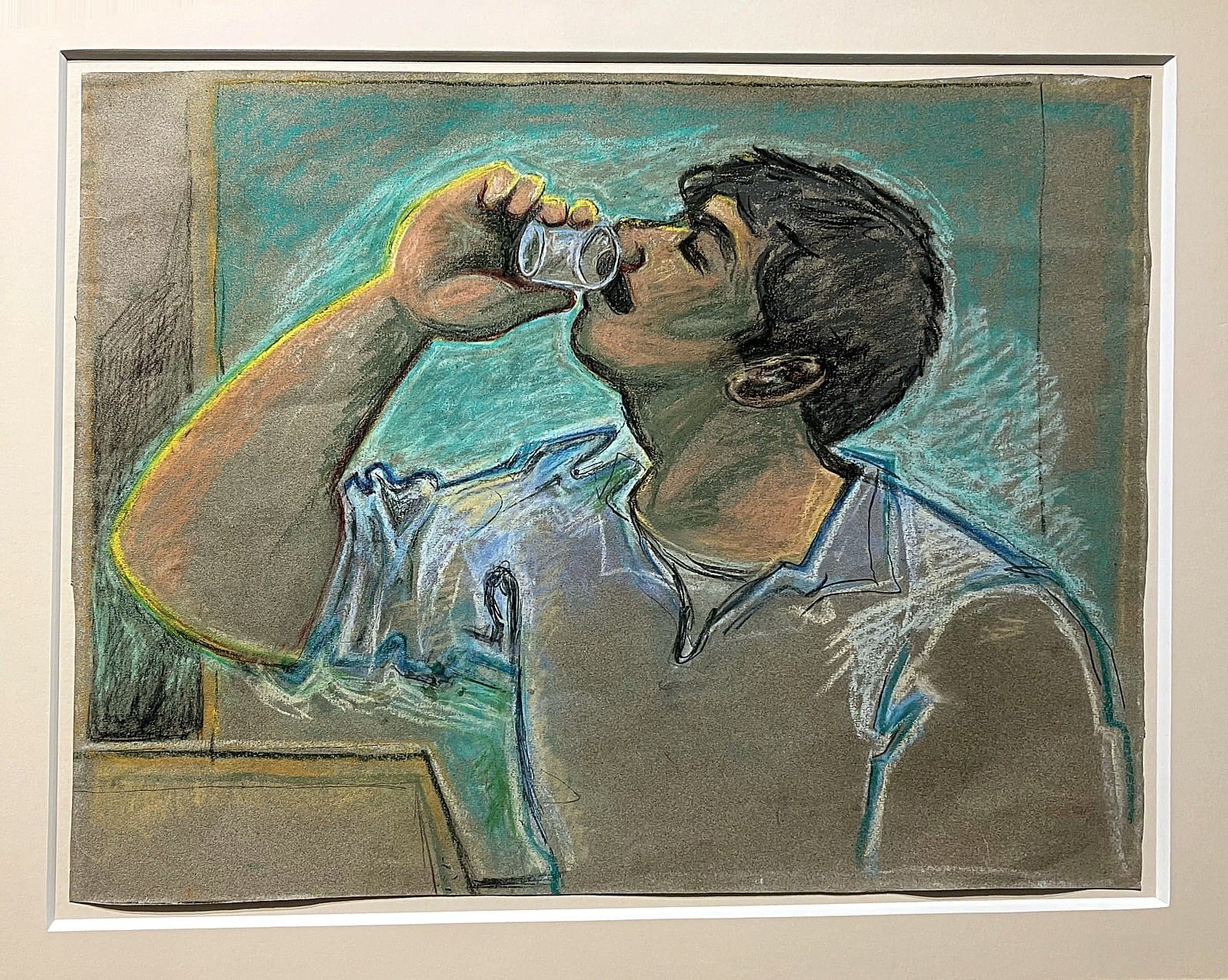 John Craxton pastel of a young man tipping back a glass of ouzo, outlined in yellow and turquoise, in a dark frame