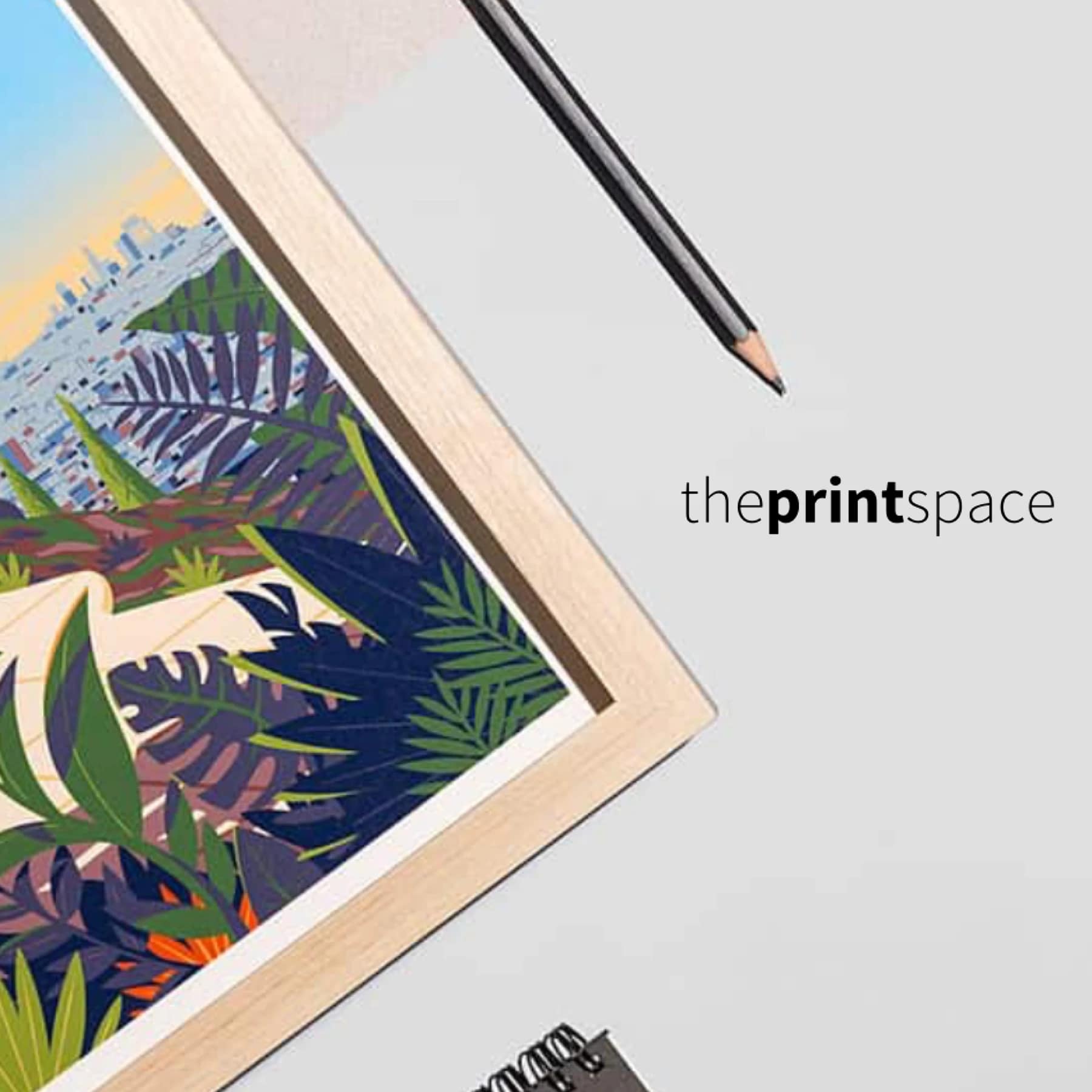 Framed colourful art print on a desk showing theprintspace’s professional print quality for our theprintspace discount code guide