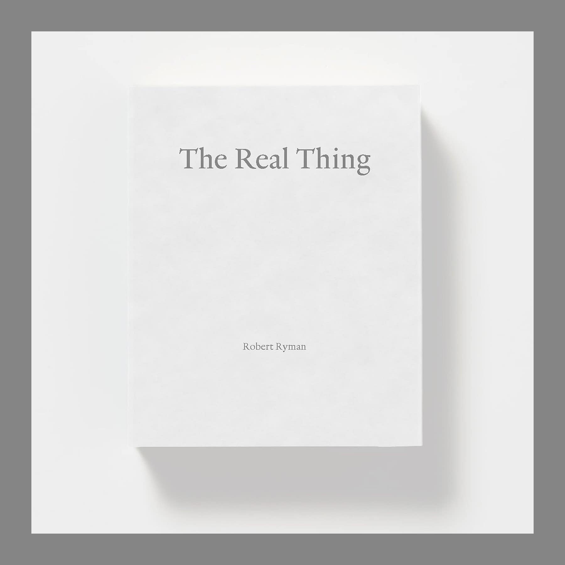 White paperback cover of the Robert Ryman: The Real Thing catalogue with its title in grey type