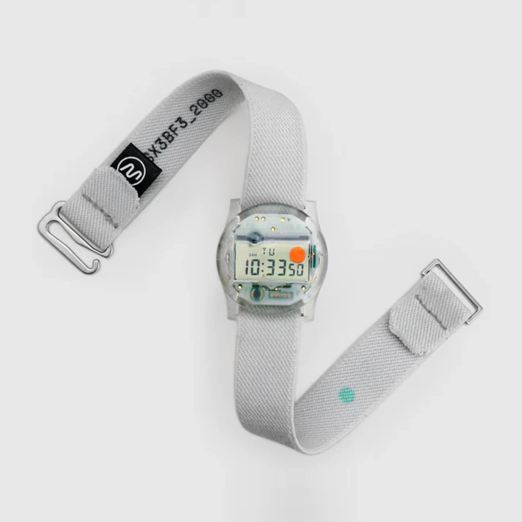 CW&T Solid State Watch UK in clear resin showing 10:33 and the orange leap-year dot, with grey Hook Strap unbuckled