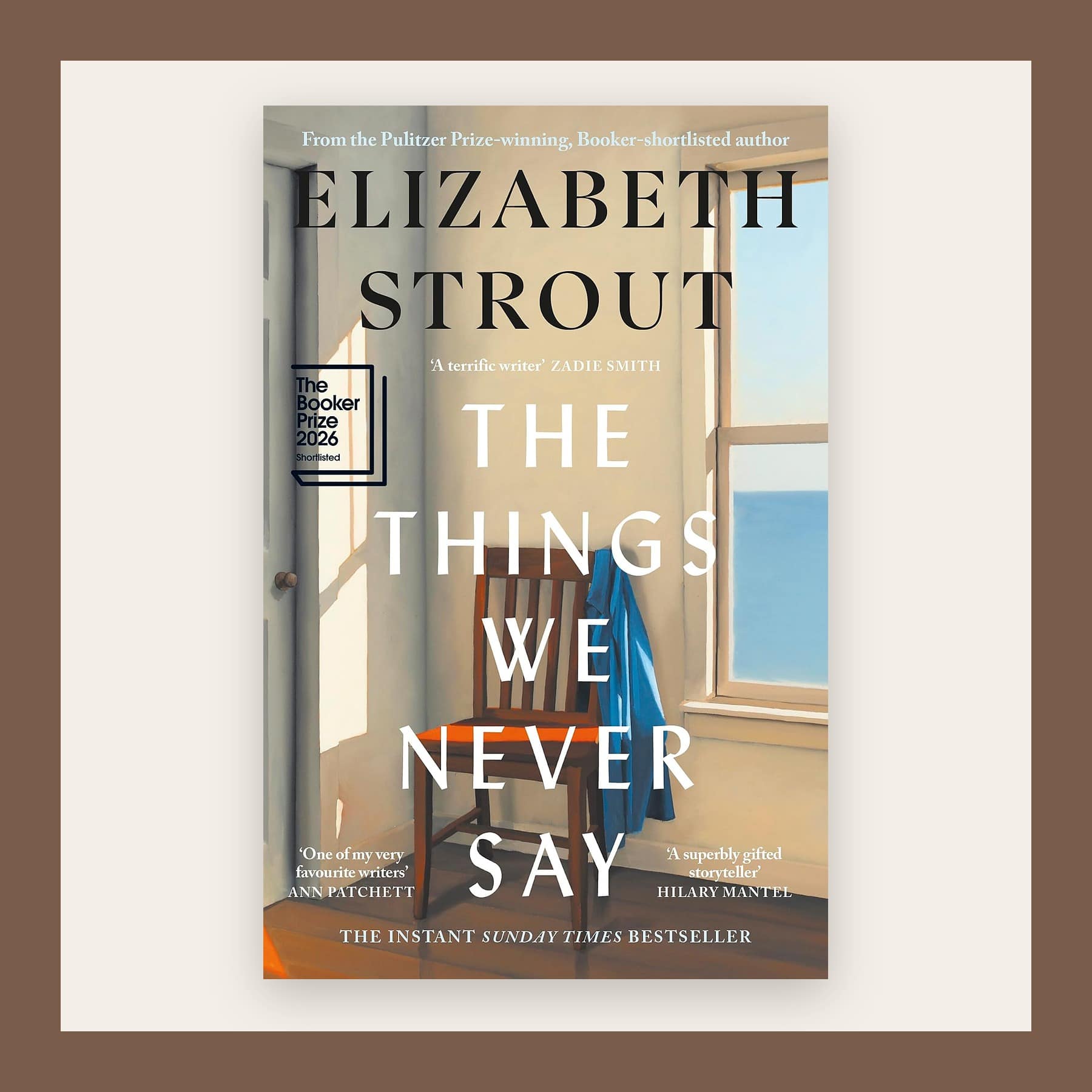 Cover of The Things We Never Say showing a sunlit window and a blue coat, in a brown frame