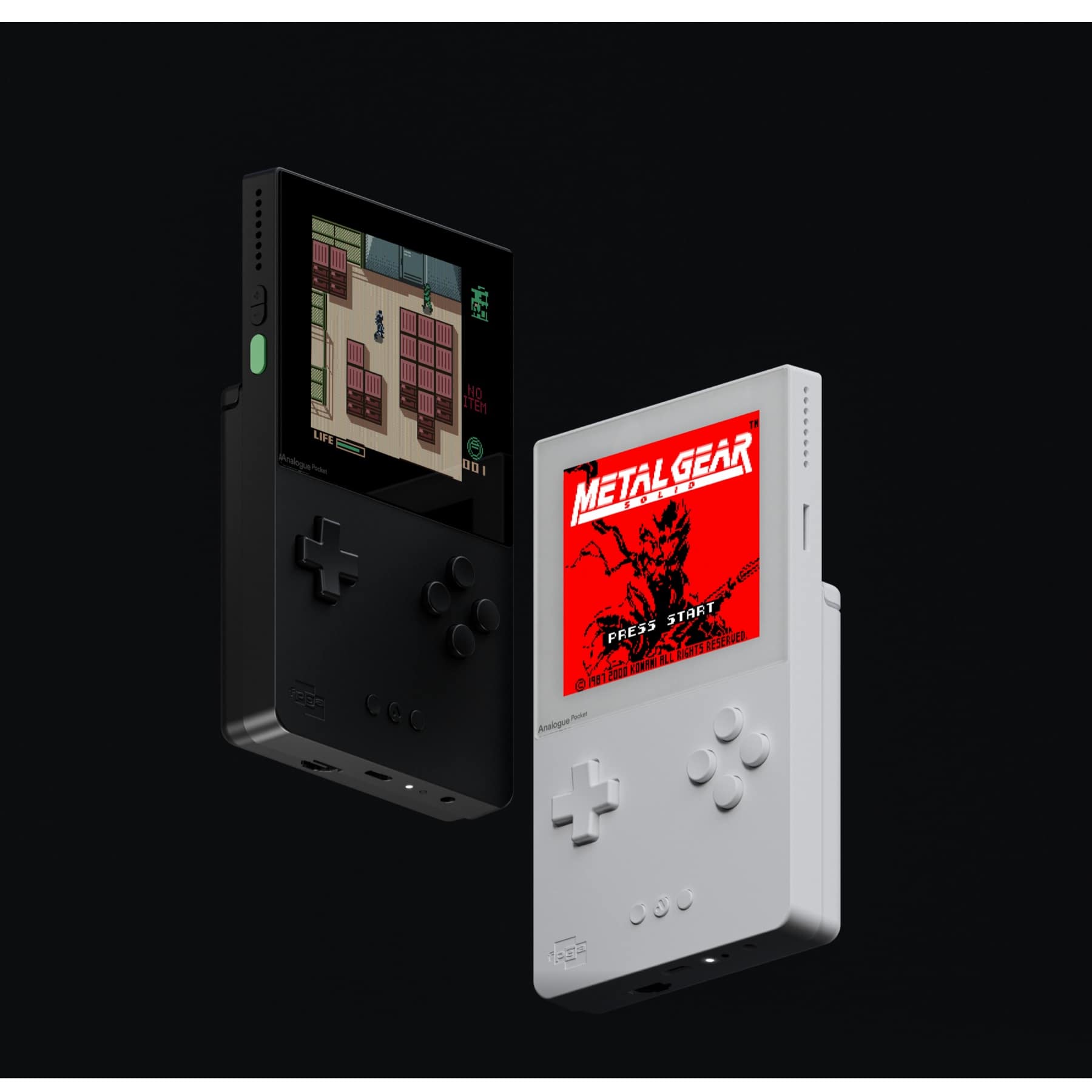Black and white Analogue Pocket handhelds displaying Metal Gear Solid and a Game Boy game