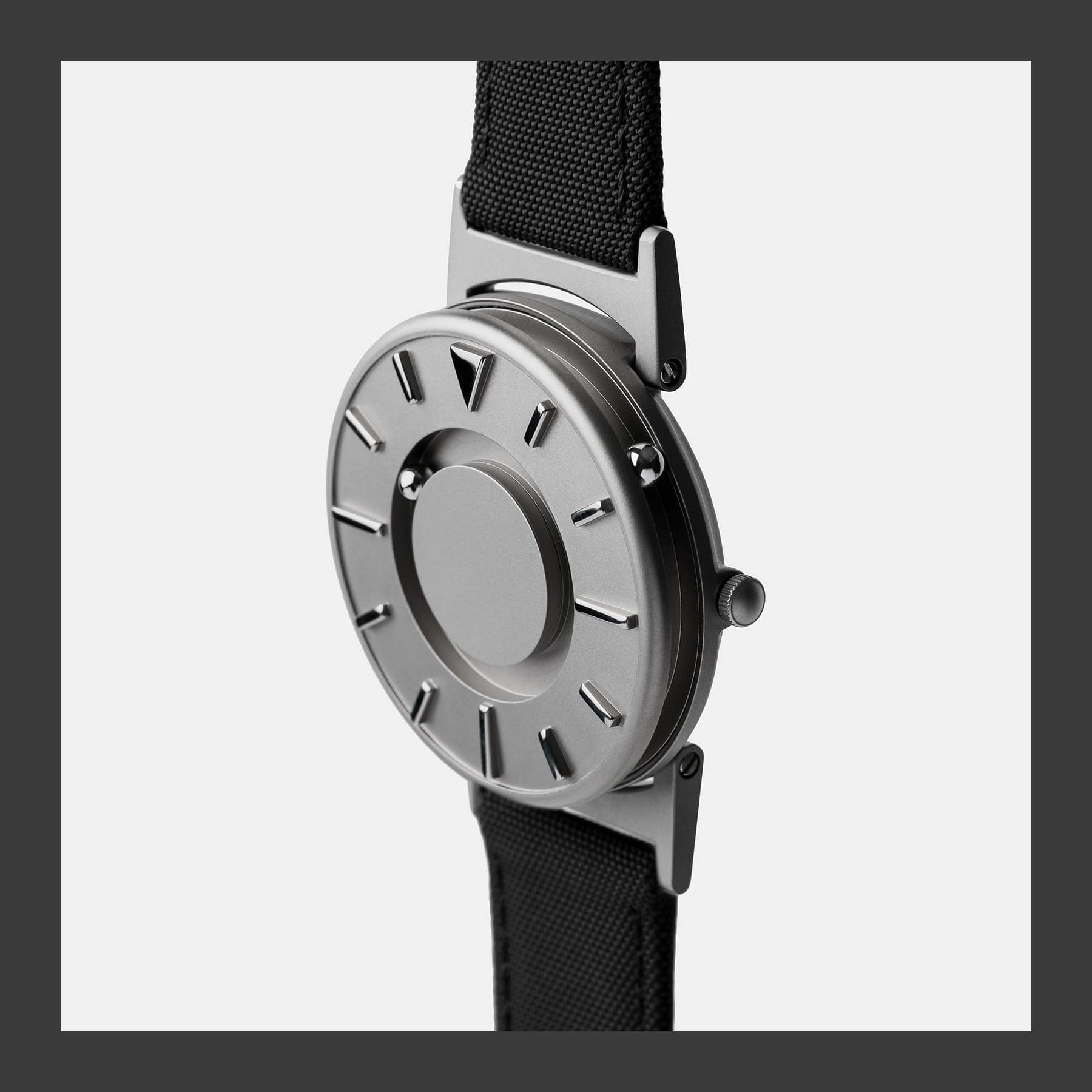EONE Bradley Canvas tactile watch in Noir with a titanium case and two ball bearings marking the time