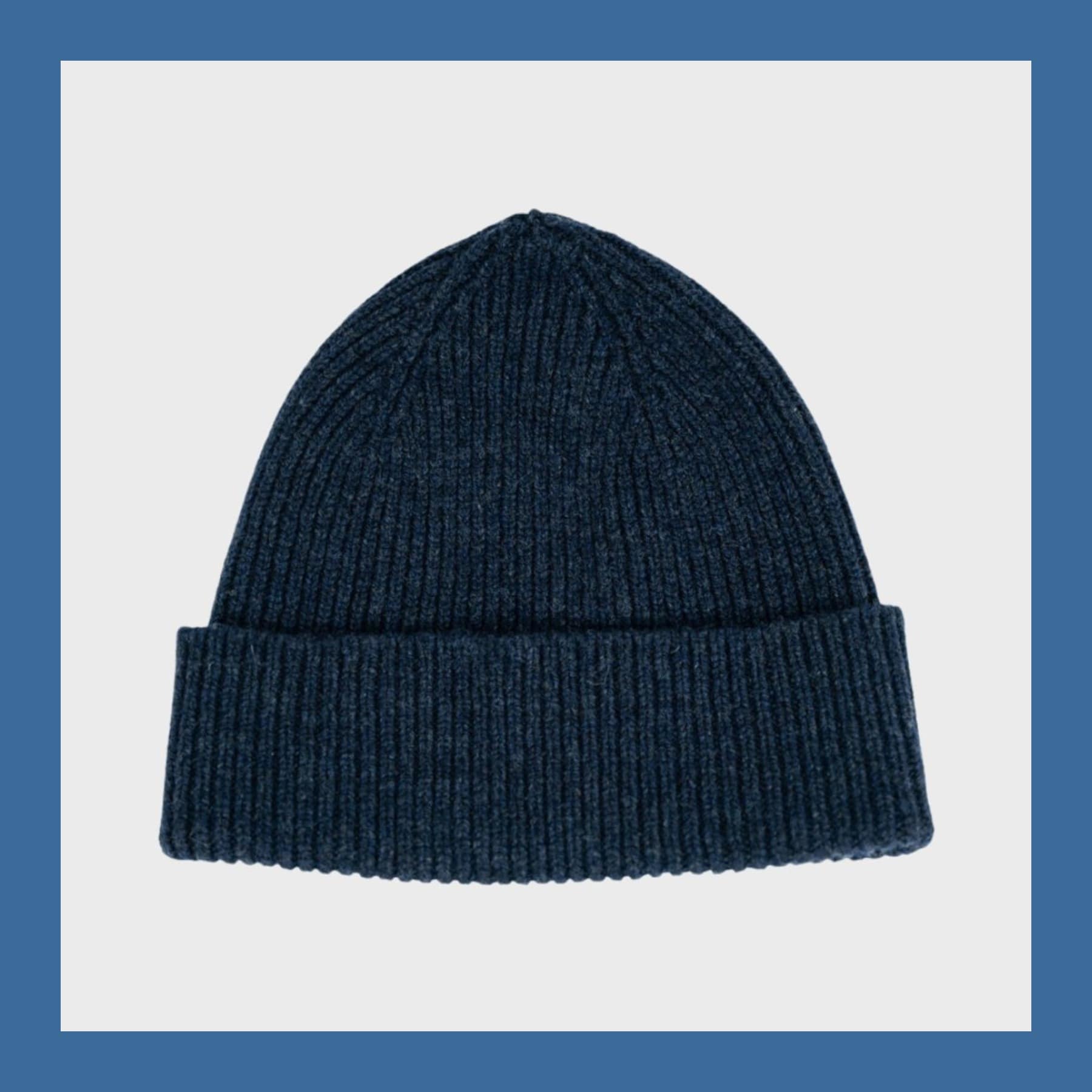 Navy ribbed lambswool beanie with a turned-up cuff, from Blackhorse Lane Ateliers, on a light grey background