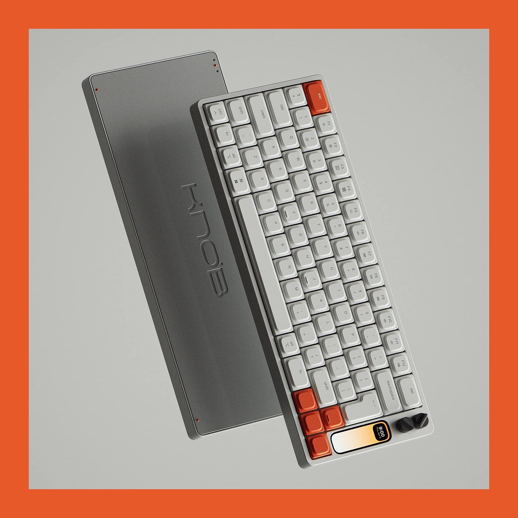 Work Louder Knob1 aluminium keyboard with orange accent keys, a small colour screen and two dials