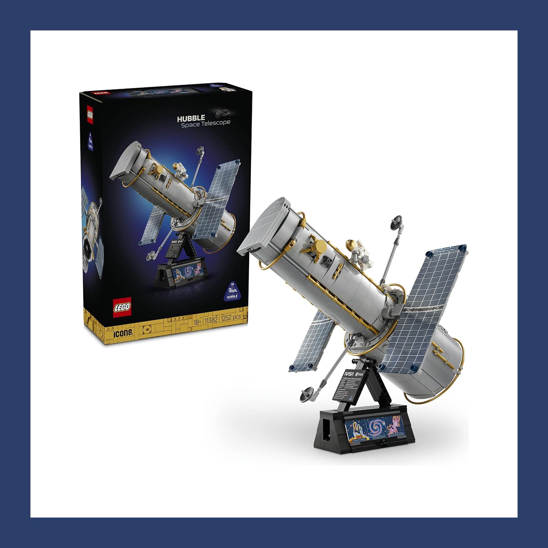LEGO Icons Hubble Space Telescope 11382 built on its display stand beside the box