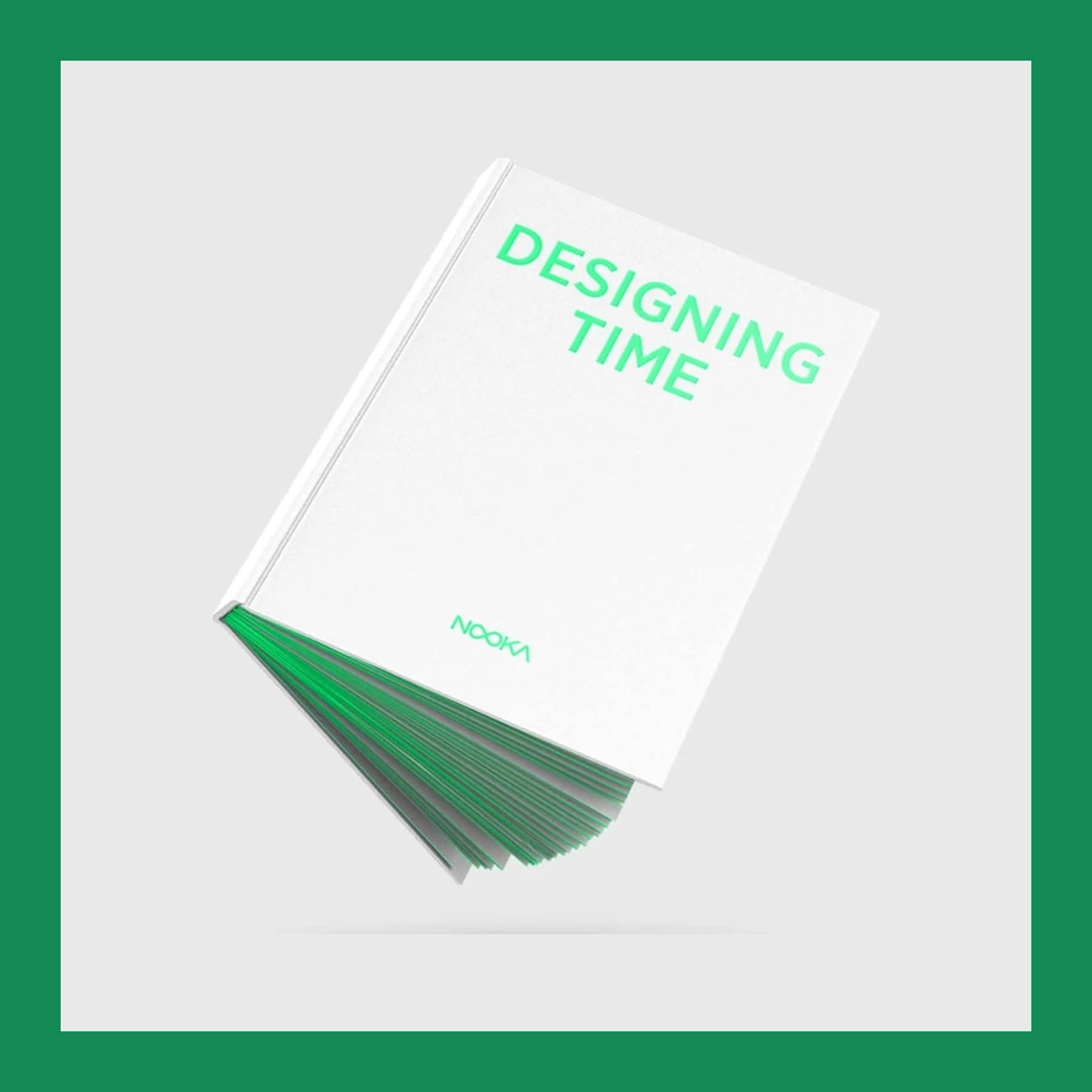 White Designing Time hardcover about NOOKA with green page edges