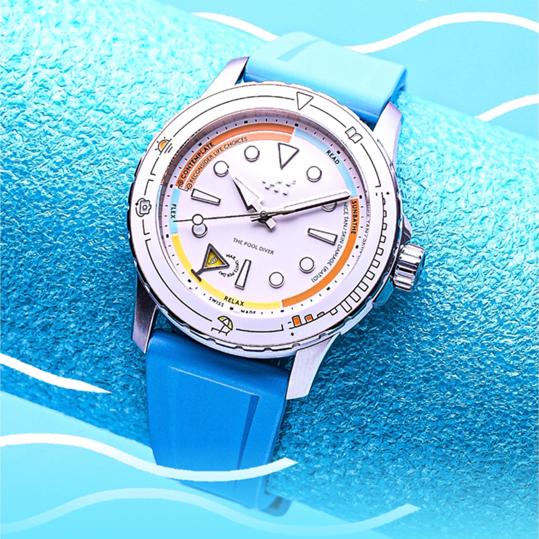 Christopher Ward C60 Pool Diver dive watch with white dial and blue rubber strap by a pool