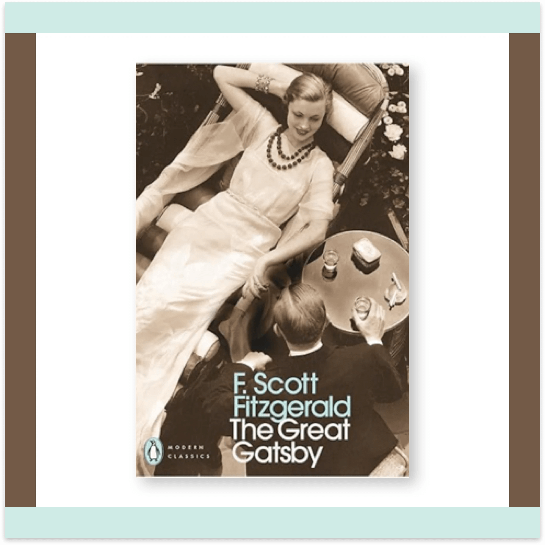Penguin Modern Classics edition of The Great Gatsby by F. Scott Fitzgerald, showing a sepia-toned overhead photo of a woman reclining and a man seated at a table