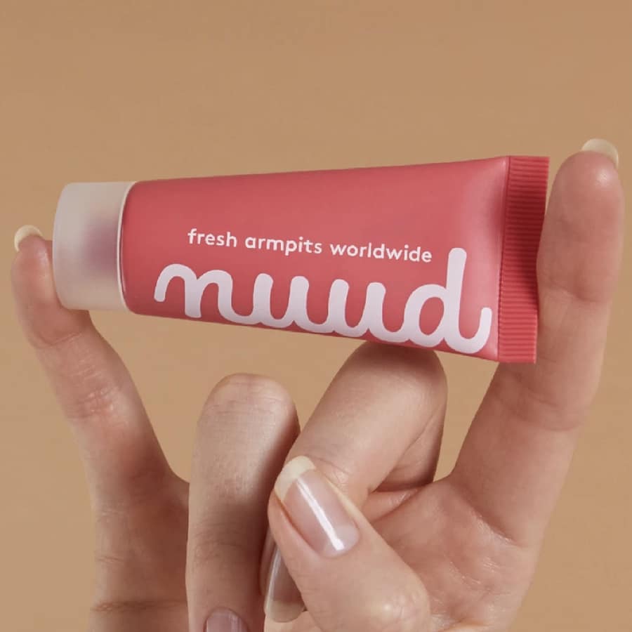 get nuud, nuud deodorant tube in a hand