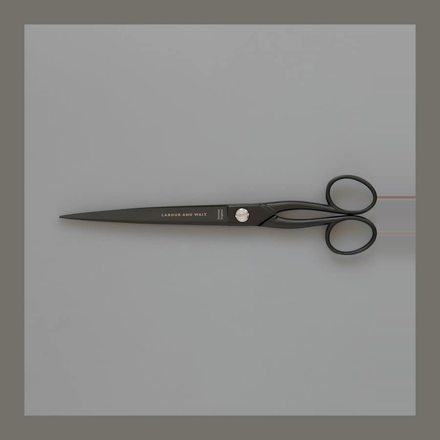 Black William Whiteley paper scissors on a grey background