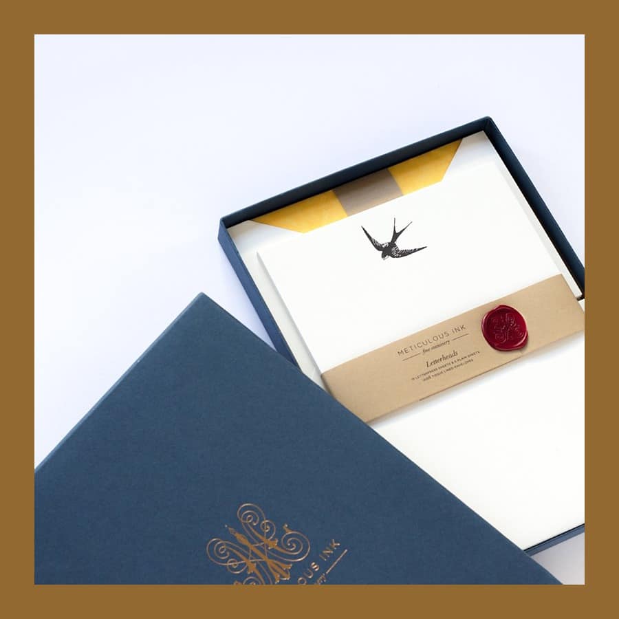 Meticulous Ink swallow letterhead box with a wax seal and yellow-lined envelopes