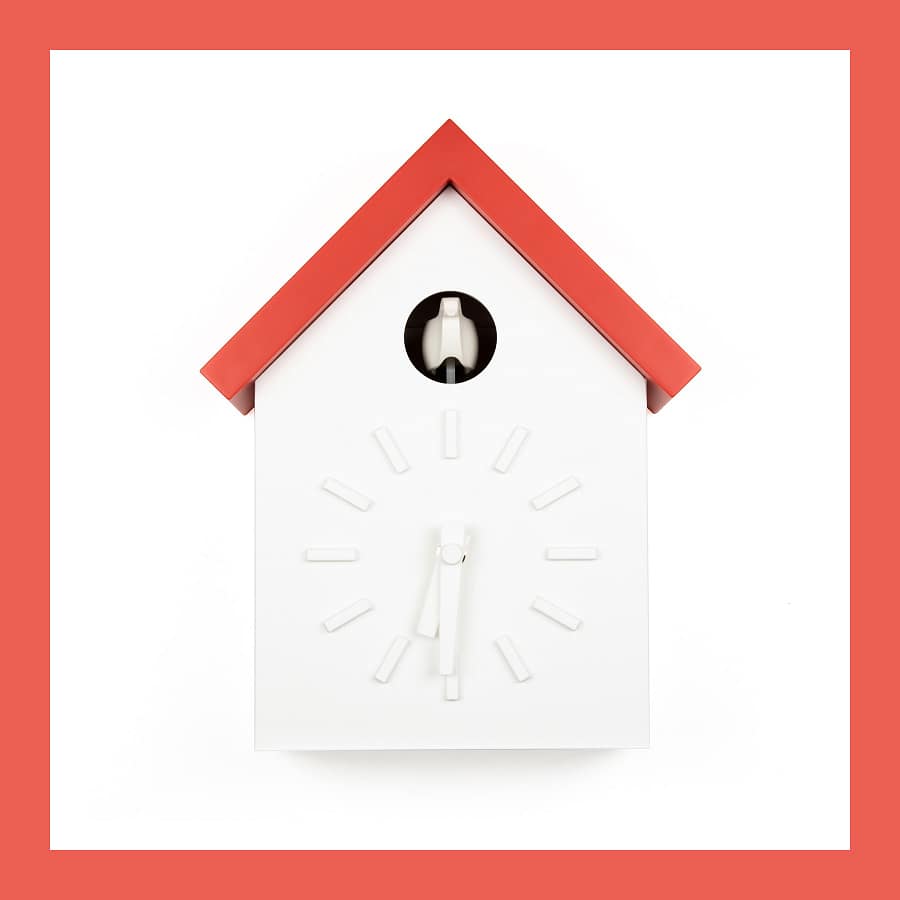 Magis Cu-Clock cuckoo clock by Naoto Fukasawa with a white house shape and a red roof