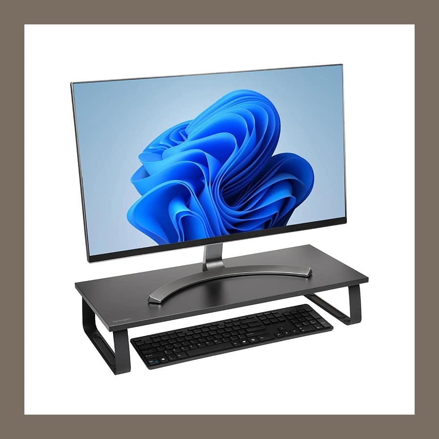 Kensington Extra Wide Monitor Stand, a long black platform on steel legs with a keyboard stored underneath