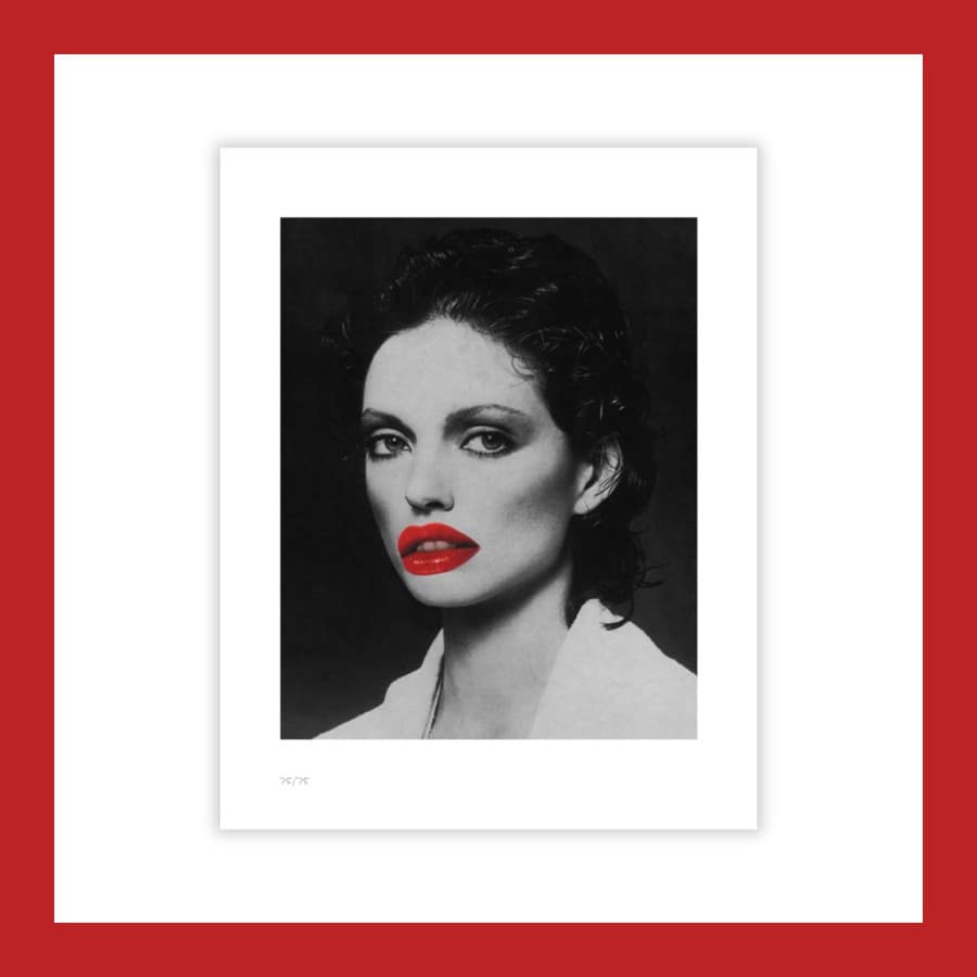 Linder print edition, a black and white portrait of a woman with bright red lips on a white sheet
