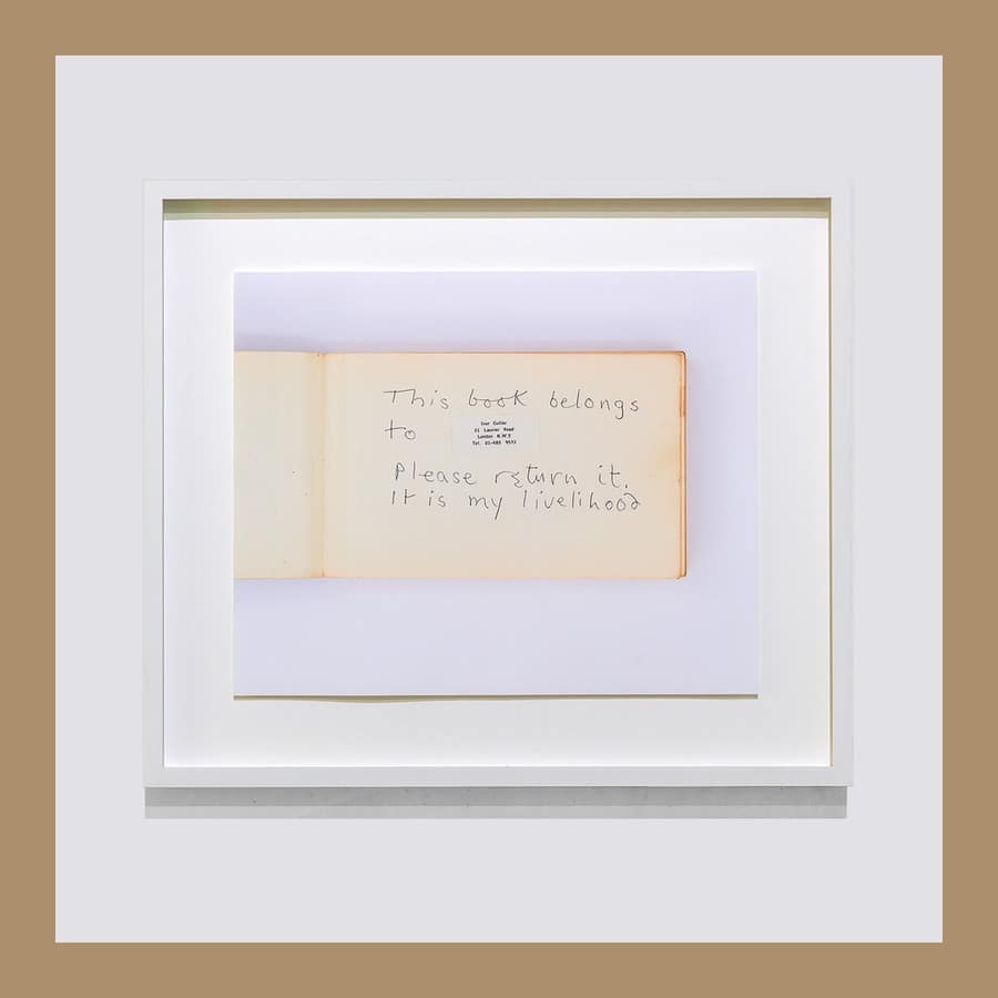 Ivor Cutler edition showing an open notebook with the handwritten words This book belongs to, please return it, in a white frame