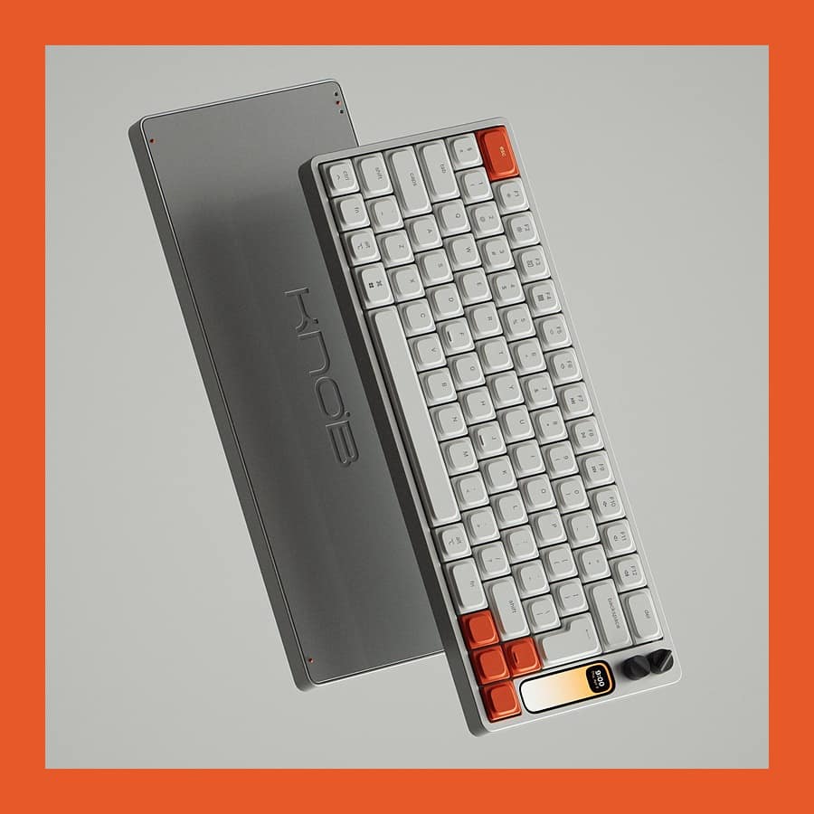 Work Louder Knob1 keyboard in grey aluminium with orange keys, two dials and a strip screen