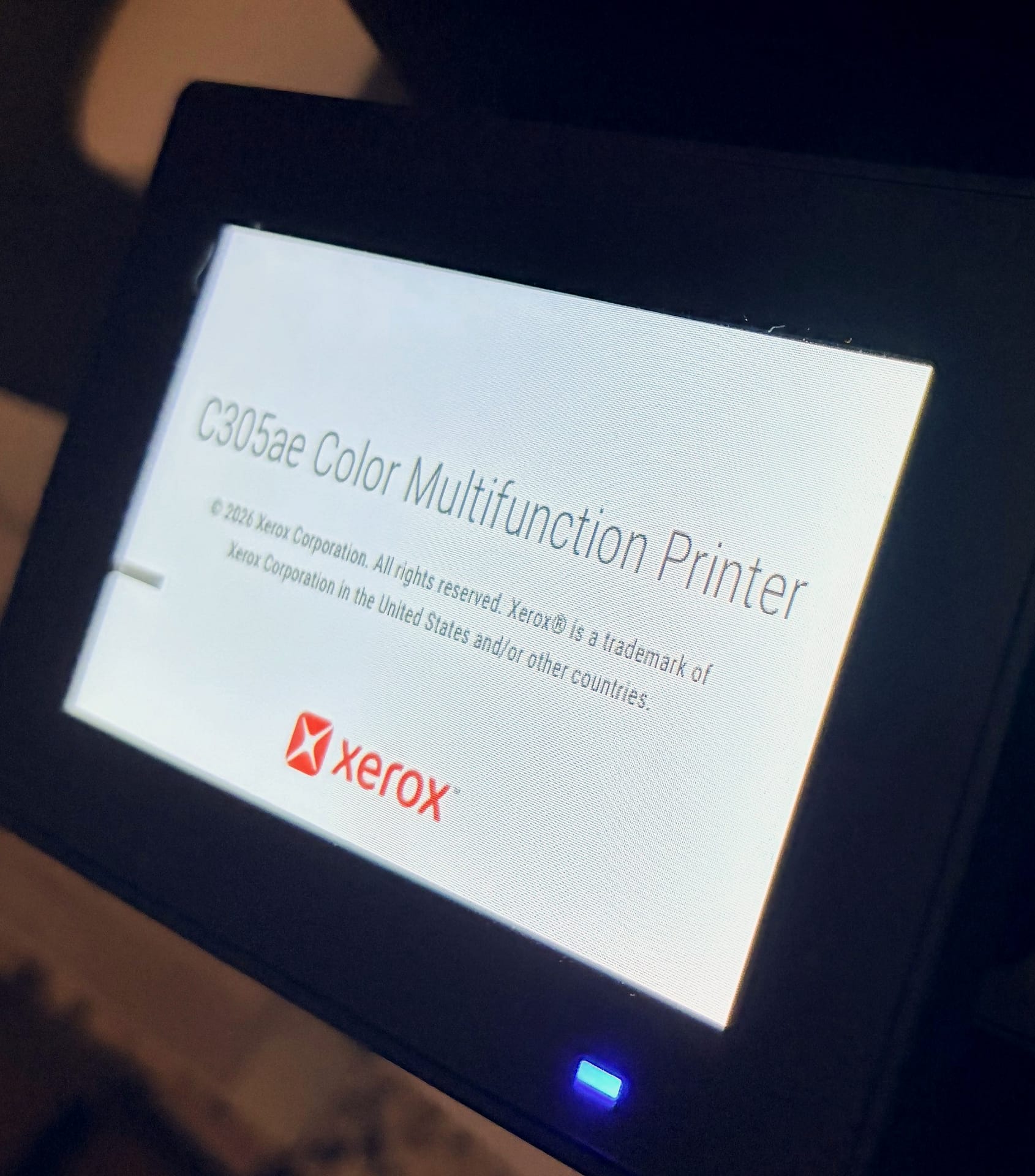 Xerox C305ae tilting touchscreen showing the boot screen with the Xerox logo