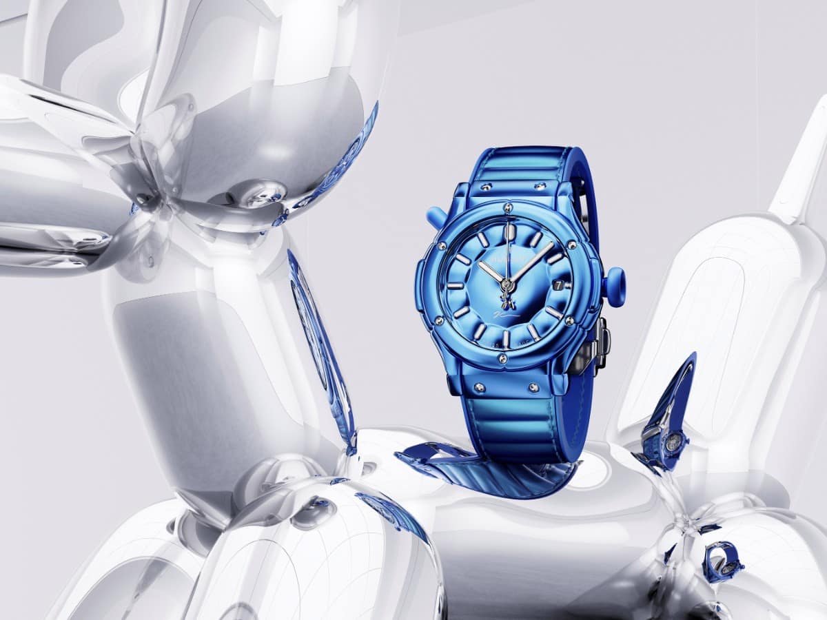 Blue Hublot Classic Fusion Balloon Dog watch resting on a silver Jeff Koons style balloon dog