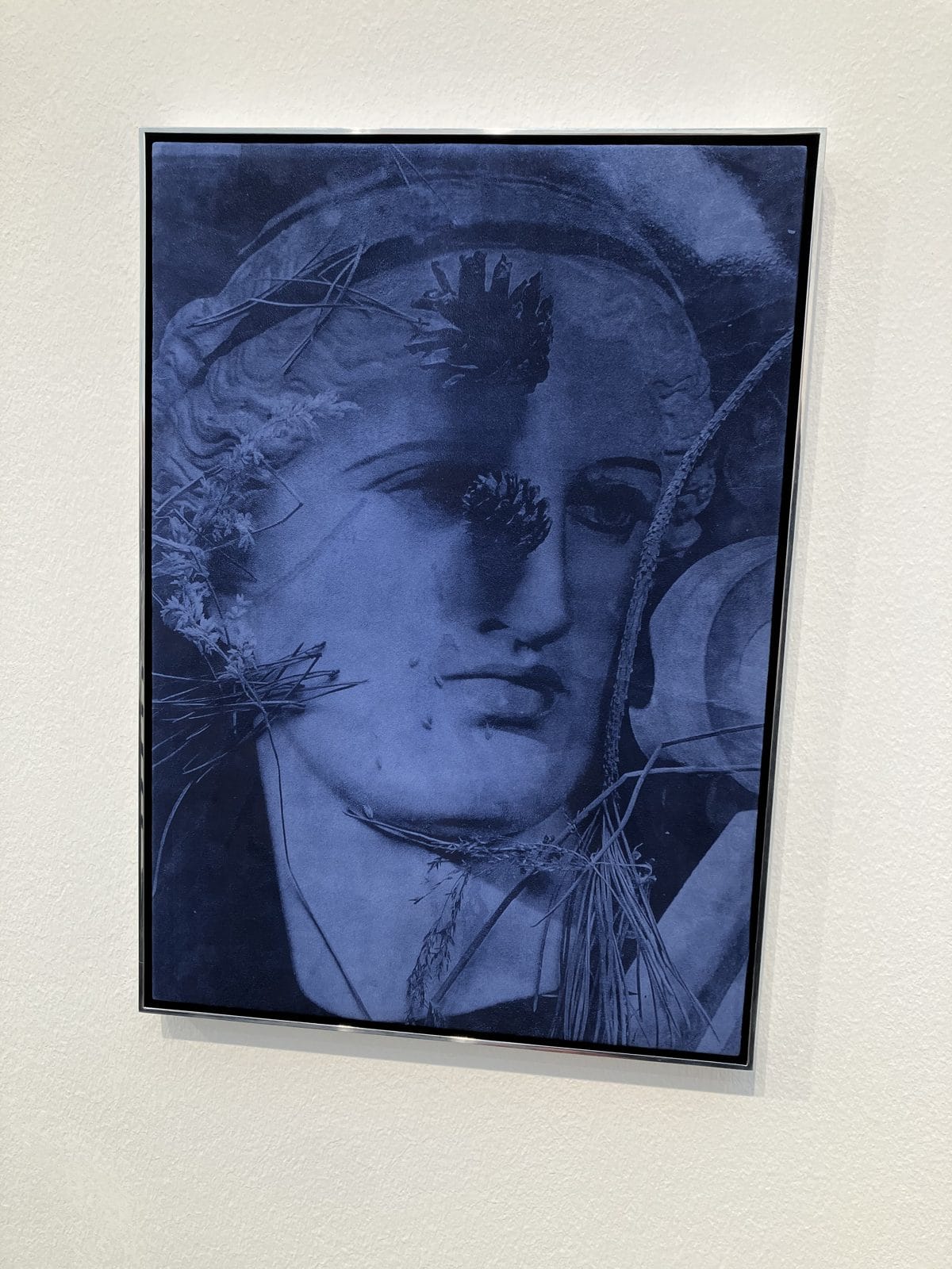 Blue classical head painted on suede by Poppy Jones in an aluminium frame