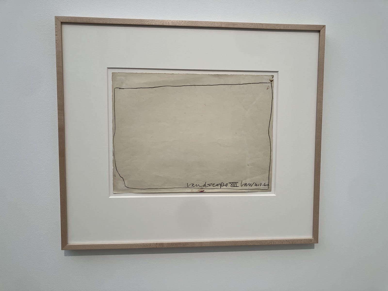 Bob Law pencil drawing of an almost empty sheet inside a wobbly hand-drawn border, in a pale wood frame