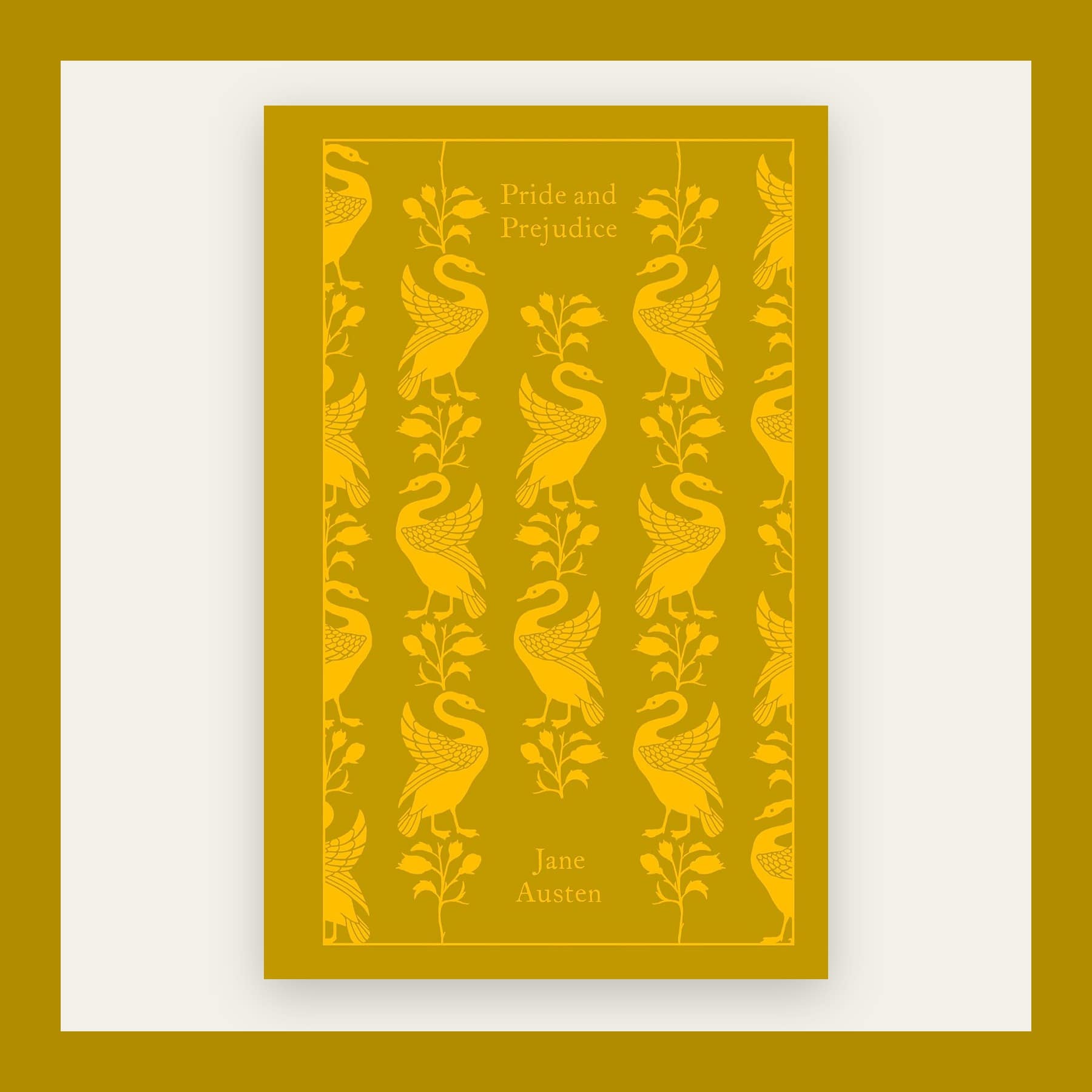 Gold clothbound cover of Pride and Prejudice with a repeating peacock pattern, in a gold frame