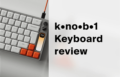 Work Louder Knob1 keyboard from above, silver aluminium body with orange accent keys, two dials and a vertical strip display