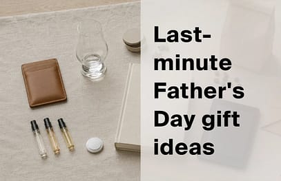 Flat-lay of last-minute Father's Day gifts including a leather card holder, whisky glass, fragrance vials and a notebook