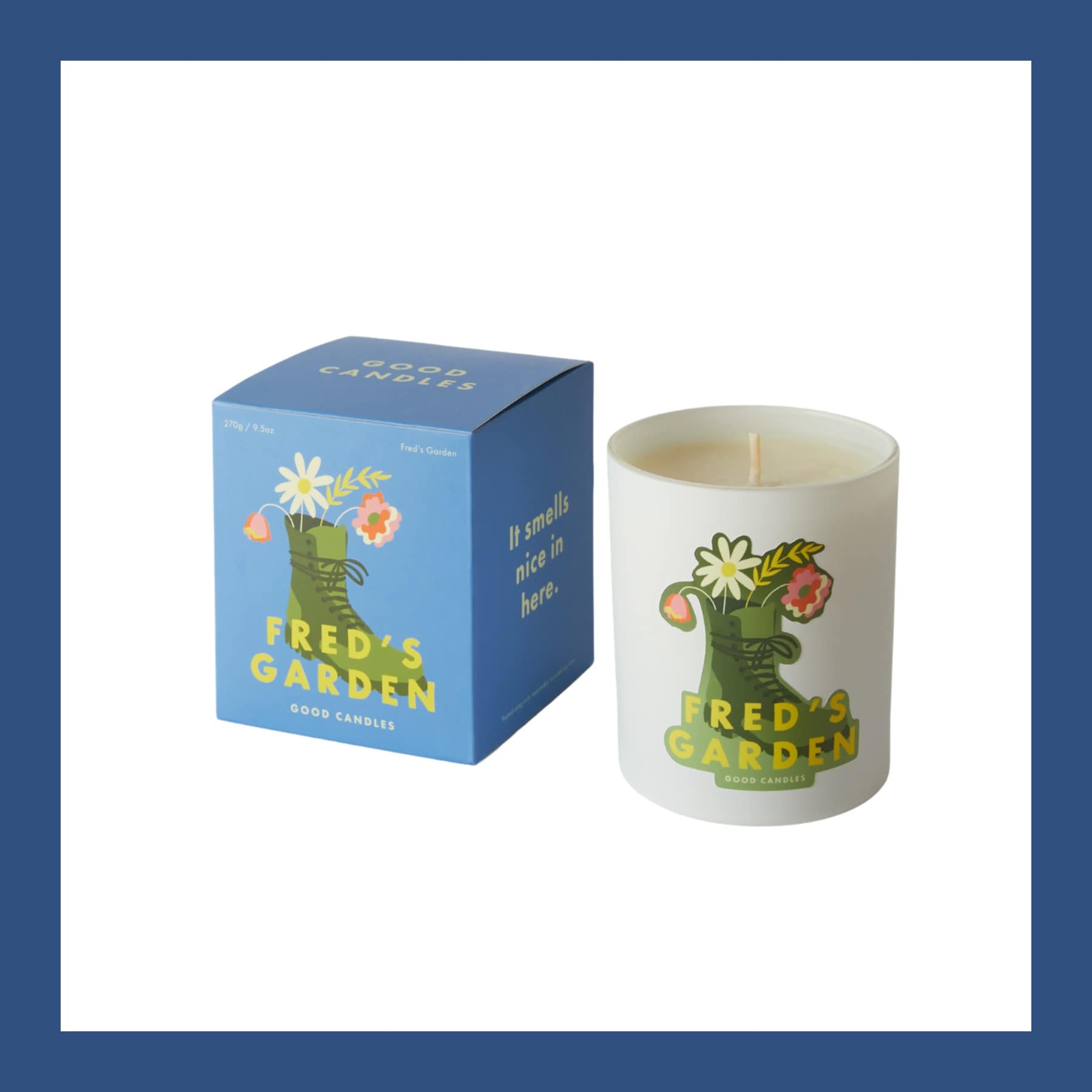 Good Candles Fred's Garden candle in a white glass with its blue illustrated box