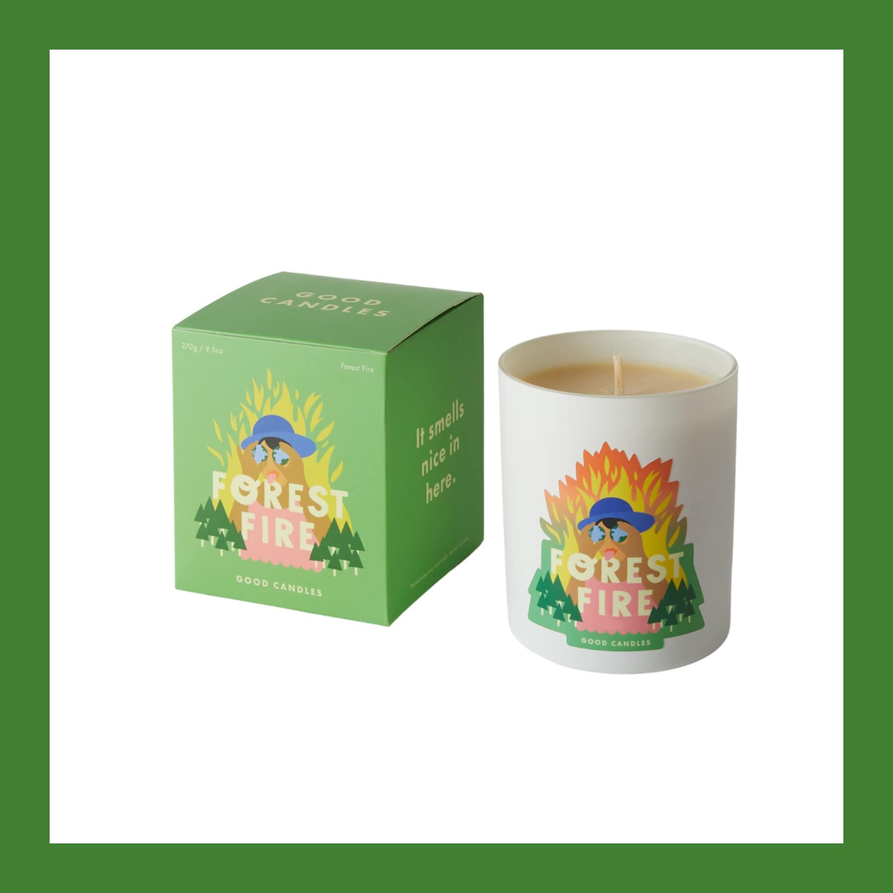 Good Candles Forest Fire candle in a white glass with its green illustrated box