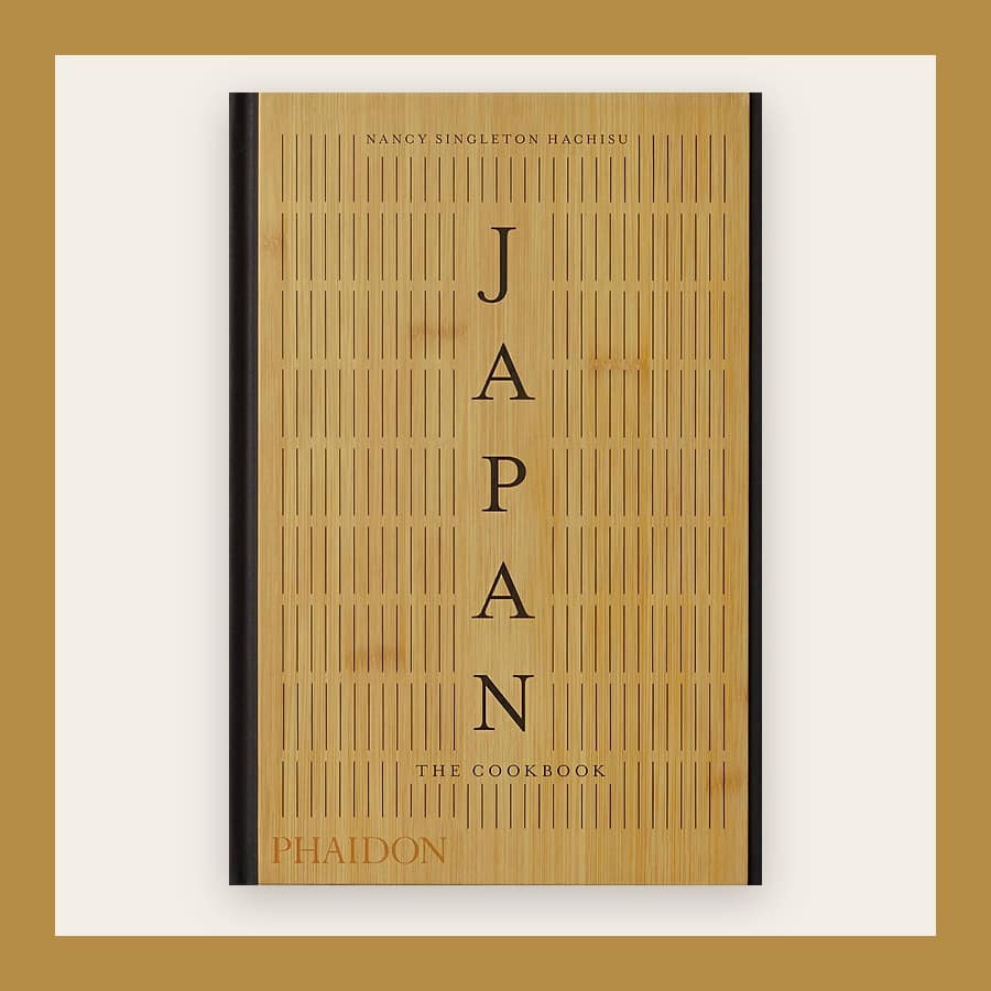 Wood-effect cover of Japan: The Cookbook with the title running down the middle, in a tan frame