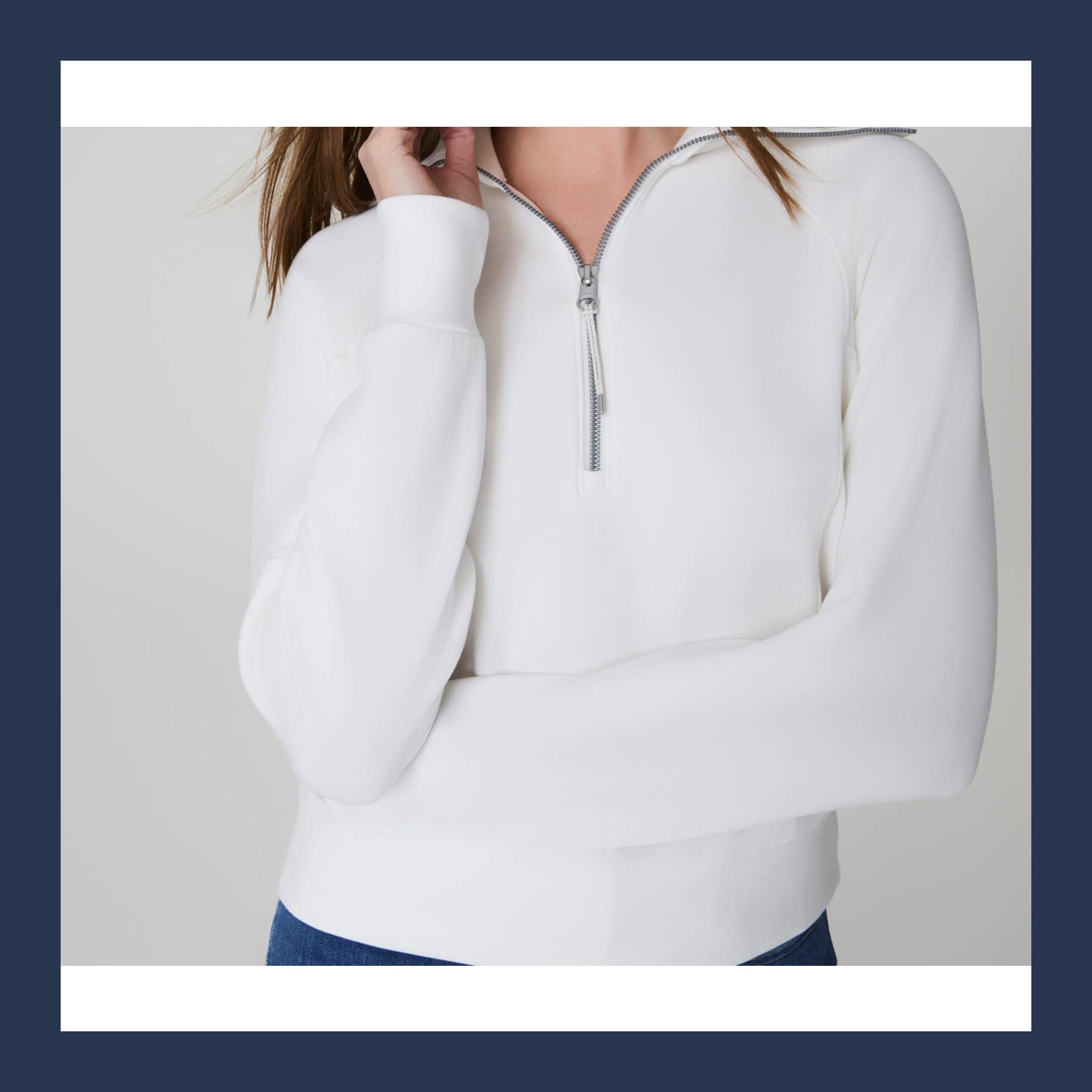 Spanx AirEssentials Half Zip in Powder white, a soft pullover with a high collar and a short silver zip