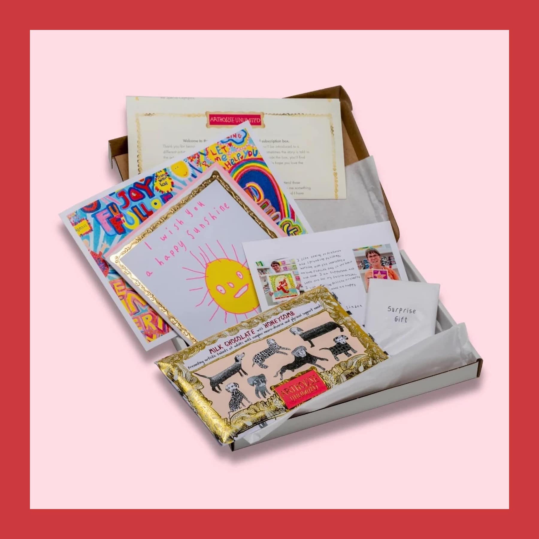 Open ARTHOUSE Unlimited Letterbox Love box with a chocolate bar, a sunshine card, an artist print, a letter and a mystery gift