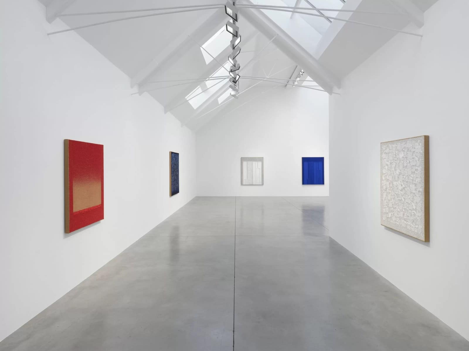 Ha Chong-Hyun paintings in red, deep blue, white and bright blue in Lisson's skylit main gallery on Bell Street