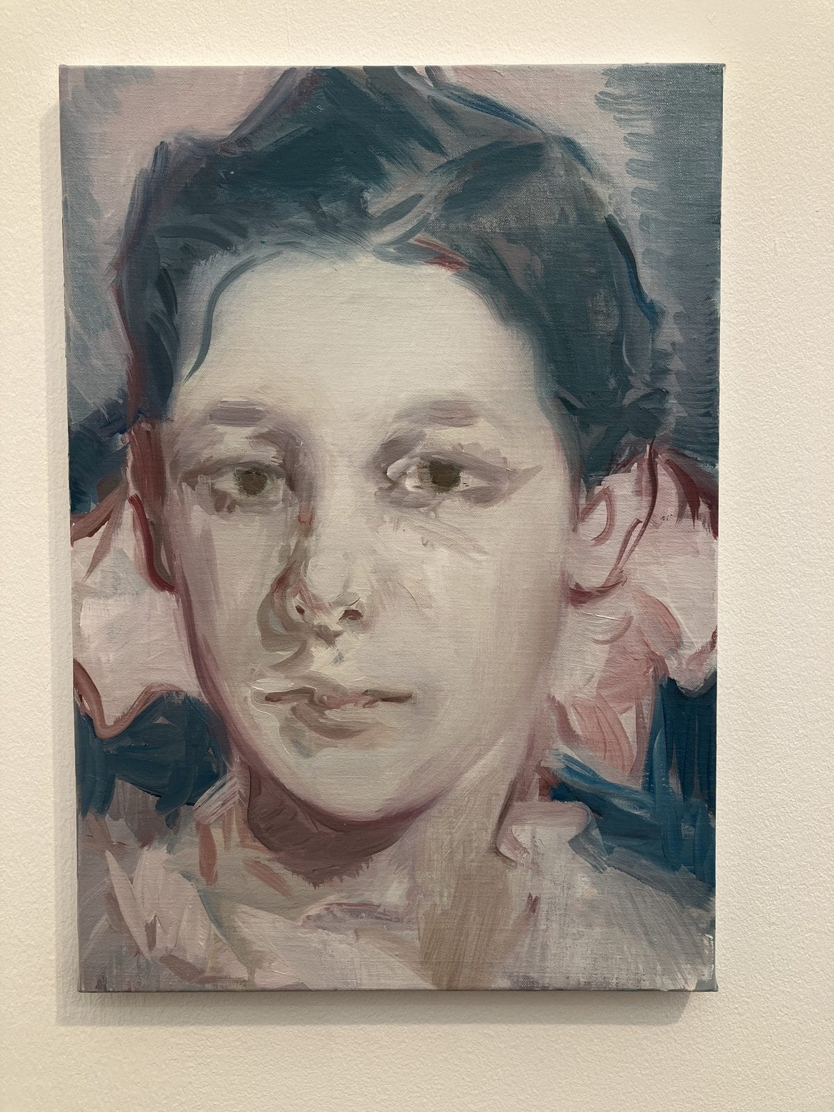 Kaye Donachie portrait of a dark-haired child in muted pinks and blues