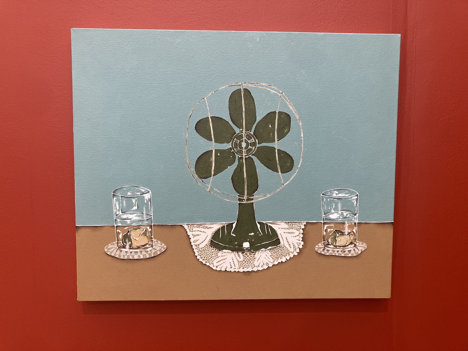 Dalton Paula painting of an electric fan between two glasses of water on lace doilies