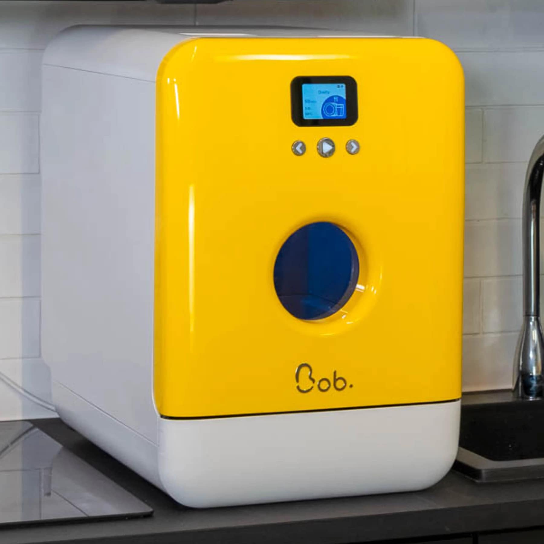 Bob the mini dishwasher in yellow on a kitchen countertop next to a sink