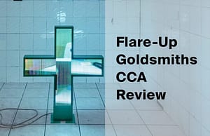Green LED pharmacy cross by Racheal Crowther in a white-tiled hall, beside the title Flare-Up Goldsmiths CCA Review.