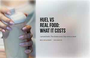 Close-up of hands holding a shaker bottle of mixed meal replacement