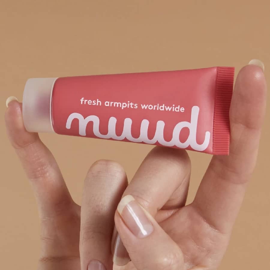 get nuud, nuud deodorant tube in a hand