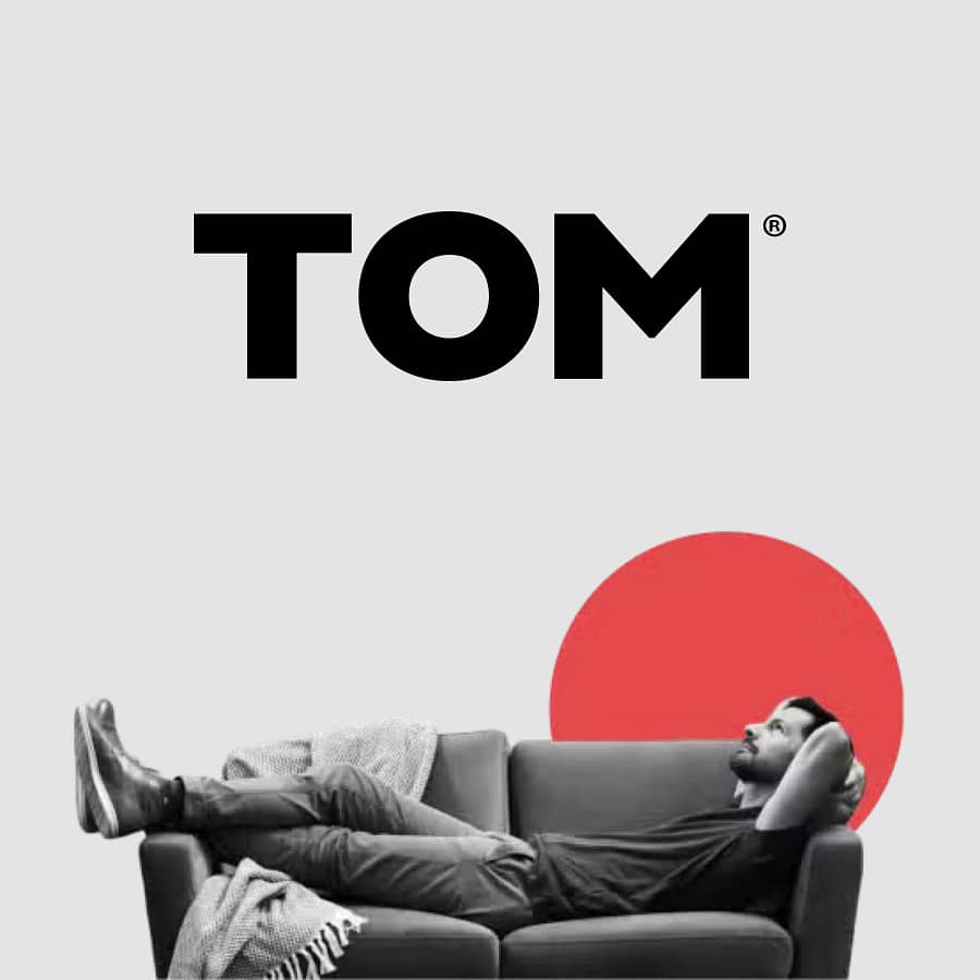 Tom Life Insurance logo with relaxed man on sofa