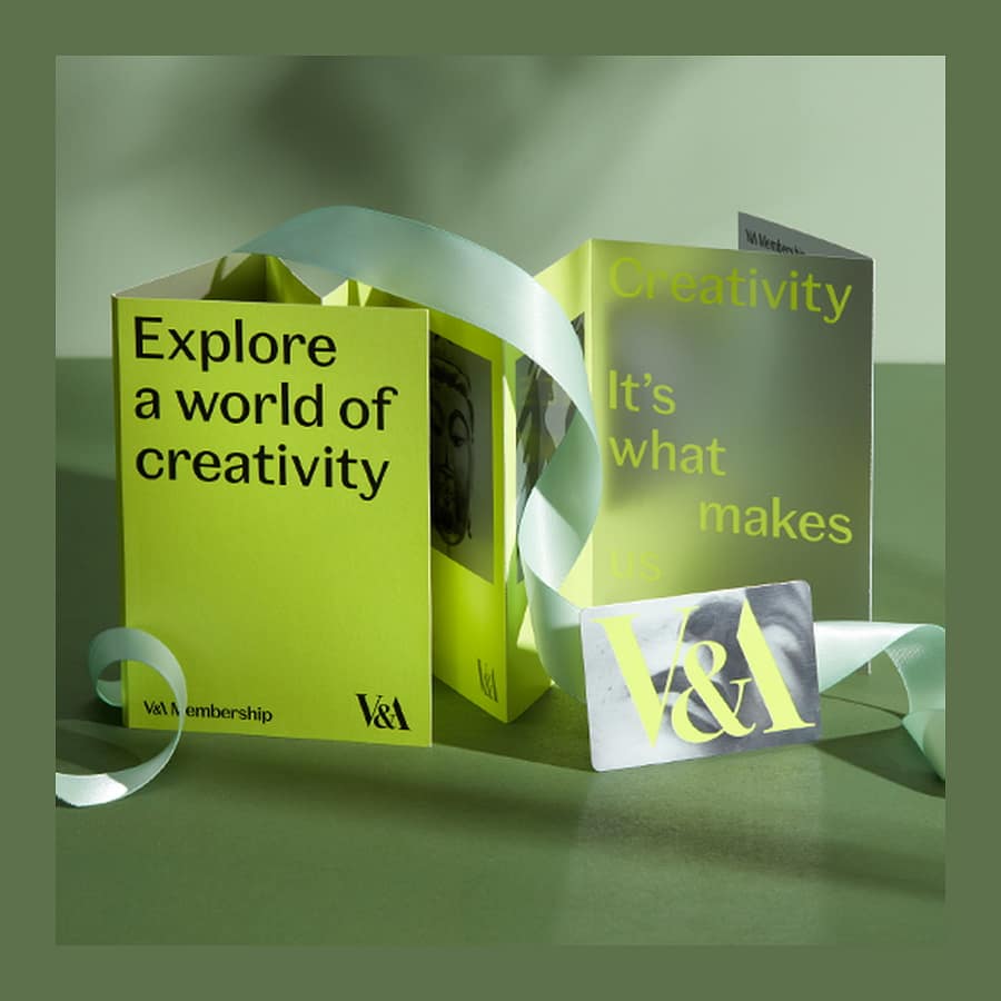 V&A Membership welcome pack with card and folded booklet on a green background