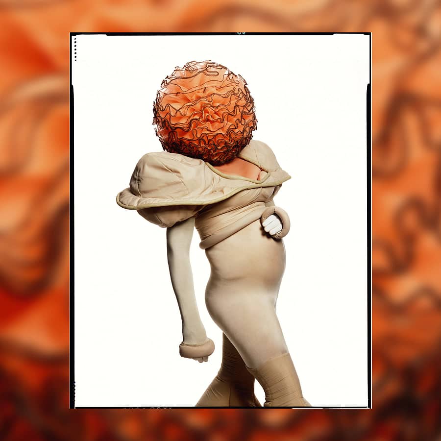 Fergus Greer’s portrait of Leigh Bowery in a cream bodysuit and ruffled orange headpiece, from the Tate Modern limited edition print series