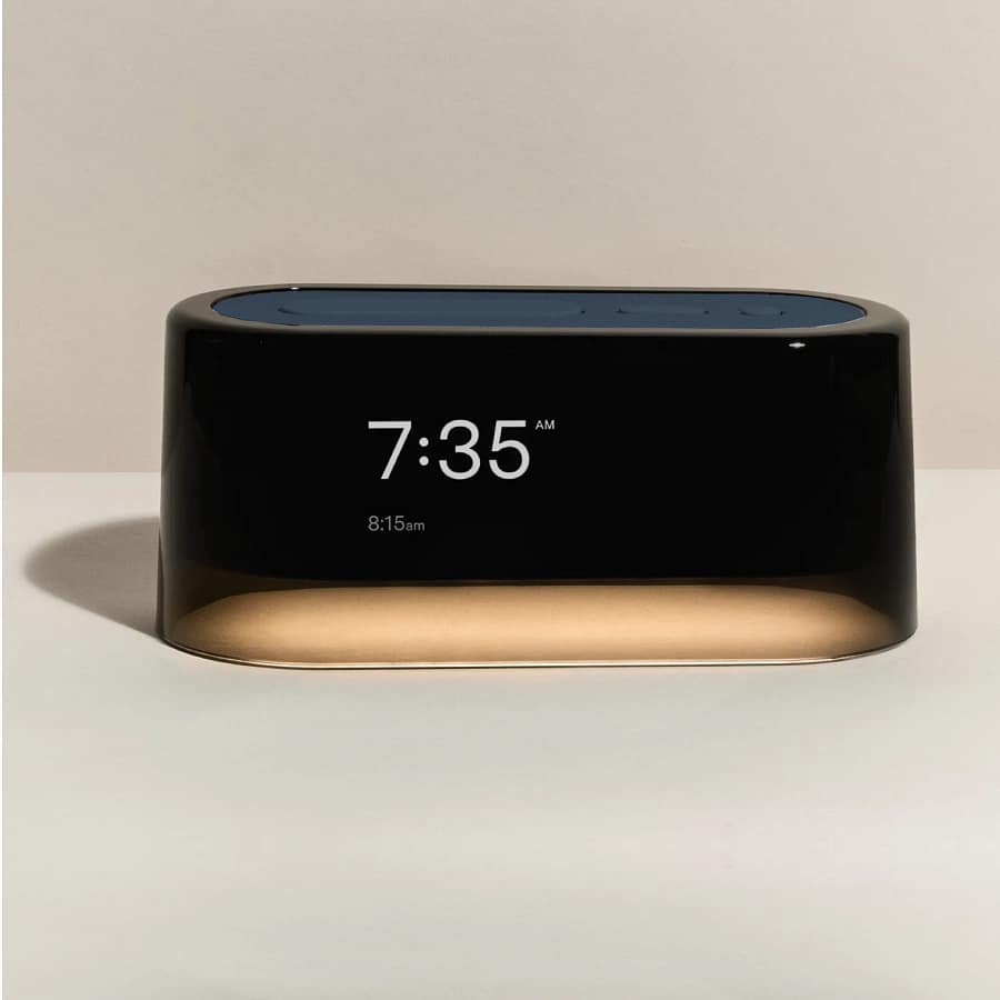 Loftie Alarm Clock displaying 7:35 AM with a sleek black and gold design on a neutral background